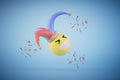 Gifts for April Fools\' Day. a laughing emoji in a jester hat around which is confetti on a blue background. 3D render