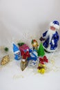 Gifts in boxes next to Santa Claus a snowman and Christmas tree close-up Royalty Free Stock Photo