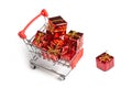 Gifts in the buyer`s basket. Full shopping cart. White isolated background. The concept of gifts and purchases before the New Yea Royalty Free Stock Photo