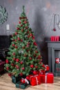 Gifts and Christmas tree. Festive Christmas interior. A beautiful living room decorated for Christmas with gifts Royalty Free Stock Photo