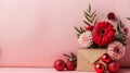 Gifts, flowers, envelope, and red ornaments on pink background. Concept for Christmas gifts