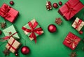 Gifts frame on a green background. Christmas or festive decorations. and red gift boxes. Copy space, top view, flat lay. stock Royalty Free Stock Photo