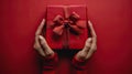 Gifts of Love: Woman\'s Hands Holding Luxury Box with Bow in Top-Down View Royalty Free Stock Photo