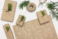 Gifts packaging inspiration. Natural design. Kraft paper, jute cord, pine twigs and scissors. Kraft paper with a picture of a deer