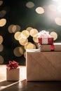 Gifts on the background of a Christmas tree with a bokeh. Royalty Free Stock Photo