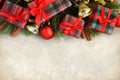 Gifts and red present boxes on fir branches background Royalty Free Stock Photo