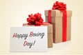 Gifts and signboard with text happy boxing day