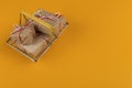 Gifts in a small shopping basket on a yellow background, concept, copy space Royalty Free Stock Photo