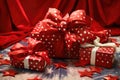 gifts with star-patterned christmas wrapping paper and big red bows Royalty Free Stock Photo