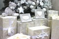 Gifts, surprises and a soft white Teddy bear under the Christmas tree for new year Royalty Free Stock Photo