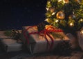 Gifts Under Christmas Tree With Starry Night Background Royalty Free Stock Photo