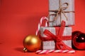 Gifts wrapped in old newspaper on red background