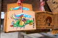 Traditional wooden prayer tablet Ema at Shirakawa Hachiman shrine in Shirakawago, Gifu, Japan. a