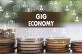 GIG ECONOMY on the touch screen with a  blur financial background Royalty Free Stock Photo