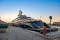 Gigantic big and large luxury mega yacht in marina of Zeas, Greece. Investment for billionaires.