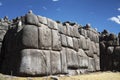 boulder of Sacsayhuaman show the scale of it with human being. It perfectly fitted together with other stones. This Royalty Free Stock Photo