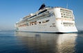 Gigantic cruise vessel leaves seaport Royalty Free Stock Photo