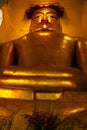 Gigantic golden Buddha statue in Manuha Paya, Myinkaba Village, Bagan, Myanmar Royalty Free Stock Photo