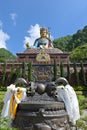 Gigantic statue of tantric master Guru Rinpoche, with Tibetan vajra (club) in the foreground, Pharping, Nepal