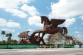 Gigantic statute of Pegasus slaying the dragon