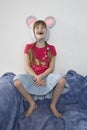 giggle girl wearing cap with mouse`s ears Royalty Free Stock Photo