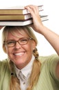 Giggling Woman Under Stack of Books on Head