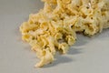 Gigli Pasta Comes Out of Plastic Bag. Royalty Free Stock Photo