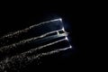 Gijon, Spain - July 23, 2022. Aerosparx, British aerobatic team flying at night with fireworks at Gijon International Air festival
