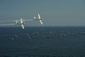 Gijon, Spain - July 24, 2022. Aerosparx, twin planes from British aerobatic team flying over sea at Gijon International Air