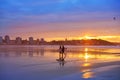 Gijon sunset San Lorenzo beach surfers in Asturias Royalty Free Stock Photo