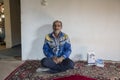 Portrait of an iranian man inside cozy room