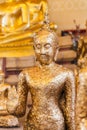 Gild ancient buddha statue in a Thai temple Royalty Free Stock Photo