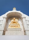 Gilded bas-relief of Buddha in a pose of a dharmachakra mudra.