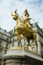 The gilded bronze statue of Joan of Arc dressed in armour on her horse is prominently displayed in Place des Pyramides