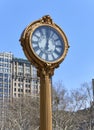 A gilded cast-iron street clock at 200 Fifth Av in NYC Royalty Free Stock Photo