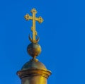 Gilded Christian Orthodox cross on the dome of the cathedral against the blue sky Royalty Free Stock Photo