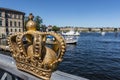 Gilded crown on the Skeppsholmsbron bridge in Stockholm, Sweden