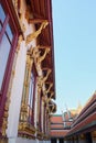 Gilded decorative elements adorn the wall of a Buddhist temple