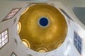 The gilded dome on the ceiling in the central hall of the Beatitude Monastery located on the mountain on the coast of the Sea of G