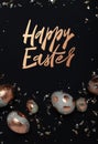 Gilded eggs and shiny confetti on a black background