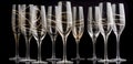 Gilded Elegance: Champagne Flutes with Gold Adornments, Set Against a Winter Wonderland\'s Noir Background, ai generative