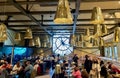 Gilded lamps hang over the Cafe Campana in the Musee d`Orsay, Paris, France Royalty Free Stock Photo