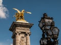 Gilded sculpture and iron lamps on Pont Alexandre III, Paris