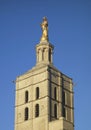 Gilded statue of Virgin Mary on top of Notre Dames des Domes Cathedral near Papal Palace in Avignon Royalty Free Stock Photo