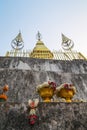 Gilded stupa and offerings at Mount Phousi Royalty Free Stock Photo