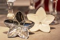 A gilded and white flower on a festively laid table is a home decor item