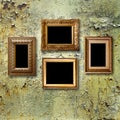 Gilded wooden frames for pictures on rusty metallic wall Royalty Free Stock Photo