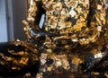 Gilding Buddha image or cover with gold leaf in thai temple Royalty Free Stock Photo