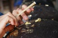 Gilding gold leaf to round stones embedded for worship Buddha. Royalty Free Stock Photo