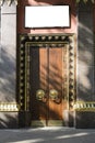 Gilding and monumental tree. entrance, gates, doors to a Buddhist temple. the concept of reliable protection Royalty Free Stock Photo